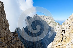 Mountains in clouds at Ellmauer Halt, Wilder Kaiser mountains of Austria - close to Gruttenhuette, Going, Tyrol, Austria - Hiking