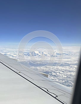 Mountains and clouds out a plane window