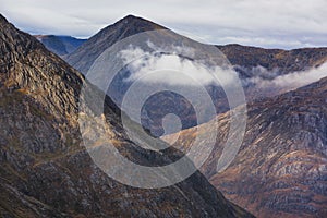 Mountains with clouds passing between