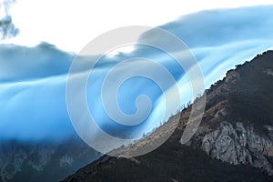 Mountains in clouds at sunset