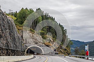 Mountains cloudy road to tunnel travel Norway