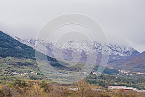 Mountains covered with snow and greenery all around