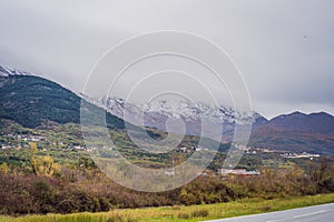 Mountains covered with snow and greenery all around