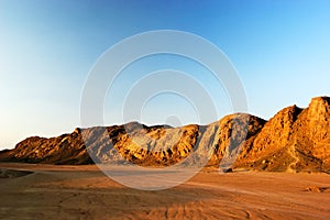 Mountains at desert at sunset