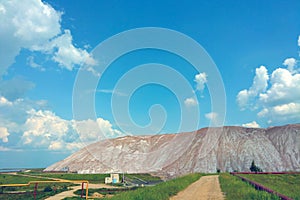 Mountains of empty ore when mining potassium. Mining industry in Soligorsk, Belarus