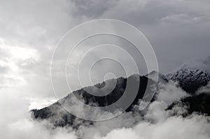 Mountains with flog clouds