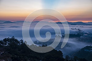 Mountains in fog at beautiful morning in autumn in Dalat city, Vietnam.