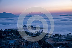 Mountains in fog at beautiful morning in autumn in Dalat city, Vietnam.