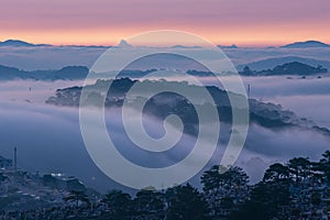 Mountains in fog at beautiful morning in autumn in Dalat city, Vietnam.