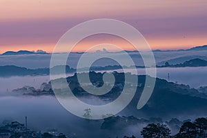 Mountains in fog at beautiful morning in autumn in Dalat city, Vietnam.