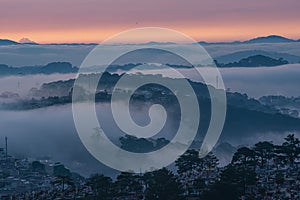 Mountains in fog at beautiful morning in autumn in Dalat city, Vietnam.