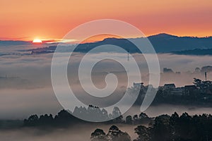 Mountains in fog at beautiful morning in autumn in Dalat city, Vietnam.