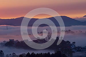 Mountains in fog at beautiful morning in autumn in Dalat city, Vietnam.