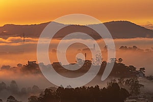 Mountains in fog at beautiful morning in autumn in Dalat city, Vietnam.