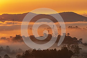 Mountains in fog at beautiful morning in autumn in Dalat city, Vietnam.