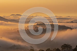Mountains in fog at beautiful morning in autumn in Dalat city, Vietnam.
