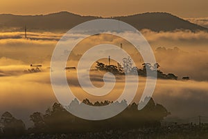 Mountains in fog at beautiful morning in autumn in Dalat city, Vietnam.