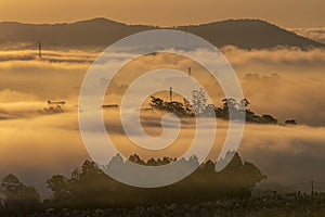 Mountains in fog at beautiful morning in autumn in Dalat city, Vietnam.