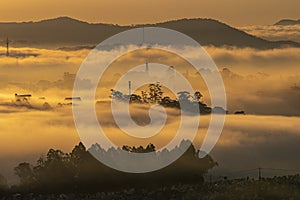 Mountains in fog at beautiful morning in autumn in Dalat city, Vietnam.