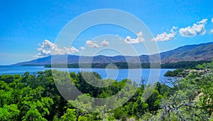 Mountains forest with green mangrove tree, clear sea and blue sky in Metinaro,Timor-Leste. photo