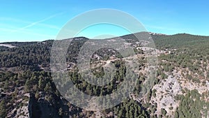 Mountains and forests of Spain from a bird`s eye view. Clear sky above the forest in the mountains.