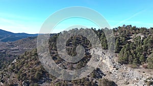 Mountains and forests of Spain from a bird`s eye view. Clear sky above the forest in the mountains.