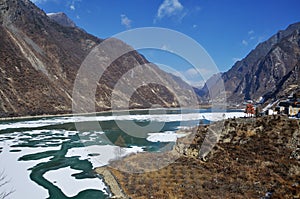 Mountains and a frozen lake. Winter in northern Sichuan Province, China