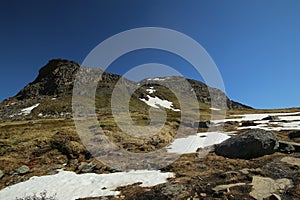 Mountains, grassland and rocks at the valley Karkevagge in Northern Sweden photo