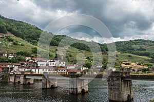 Mountains, houses and one bridge of Spain photo