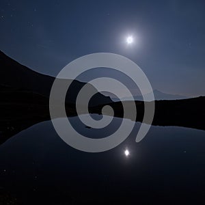 Mountains and lake of the lausfer under the moon