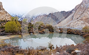 Mountains with lake and trees landscape in autumn at Pakistan