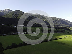 Mountains and meadows in a beautiful landscape in Austria at the Brenner Pass at sunset