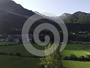 Mountains and meadows in a beautiful landscape in Austria at the Brenner Pass at sunset