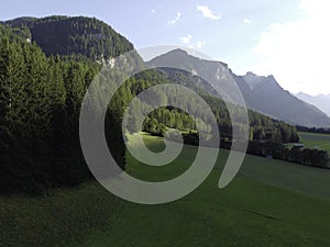 Mountains and meadows in a beautiful landscape in Austria at the Brenner Pass at sunset