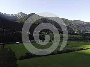 Mountains and meadows in a beautiful landscape in Austria at the Brenner Pass at sunset