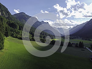 Mountains and meadows in a beautiful landscape in Austria at the Brenner Pass at sunset