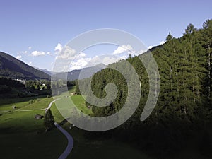 Mountains and meadows in a beautiful landscape in Austria at the Brenner Pass at sunset