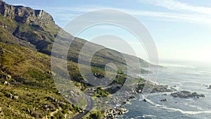 Mountains, ocean and seaside with environment, drone and sky with clouds, earth hills and travel. Cape Town, outdoor and