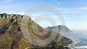 Mountains, ocean and seaside with nature, drone and sky with clouds, earth hills and travel. Cape Town, beach and water