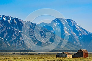 Mountains with old farmhouse and barn in foreground