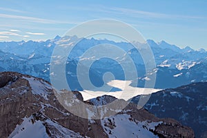 Mountains and overcast over lake in Alps. Pilatus, Lucerne, Switzerland