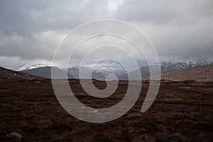 Mountains overlooking Rannoch Moor in the highlands of Scotland under gloomy skies