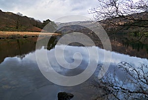 Mountains reflected in a still waters of lake Llyn Gwynant