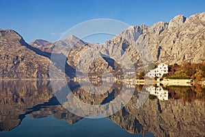 Mountains reflected in the water, winter Mediterranean landscape. Montenegro, Bay of Kotor photo