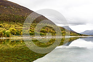 Mountains reflecting in clear water, Norway