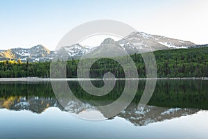 Mountains reflecting in Silver Lake Flat Reservoir, on the Alpine Loop Scenic Byway, in Uinta-Wasatch-Cache National Forest, Utah