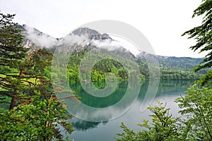 Mountains and reflections in Alpsee Lake
