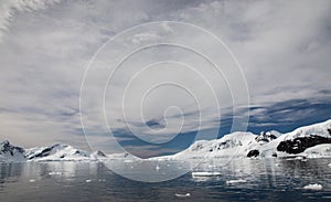 Mountains and reflections in Paradise Harbour, Antarctica