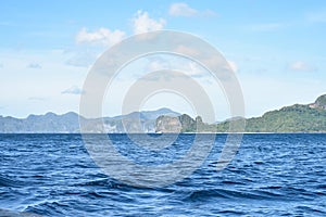 Mountains of rock formation and blue water