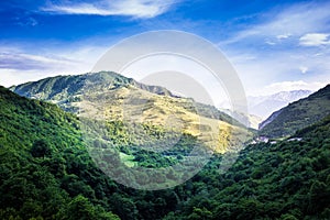 Mountains rocks a relief a landscape a hill a panorama Caucasus top a slope clouds the sky a landscape